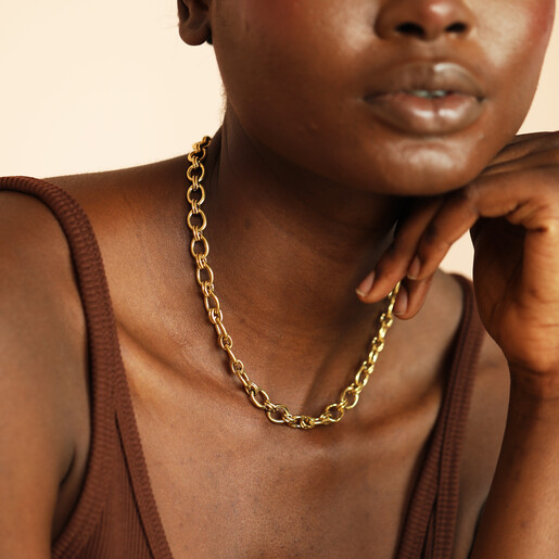 gold waterproof necklace on model 