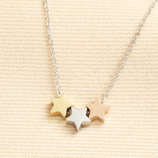 Stainless steel trace chain necklace featuring silver, gold, and rose gold star charms