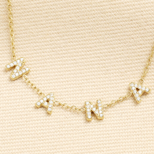 Close-up of gold stainless steel Nana necklace with sparkling crystals
