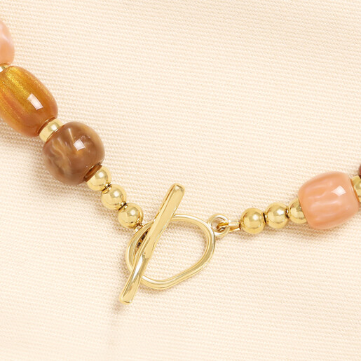 Close-up of gold T-bar toggle clasp on the chunky autumn beaded necklace