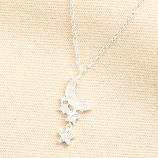 Silver mother of pearl moon and star pendant necklace displayed on fabric