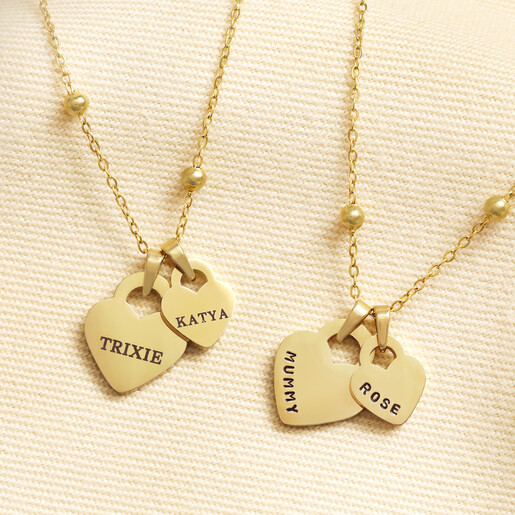 Two gold personalised stainless steel double heart charm necklaces on satellite chains