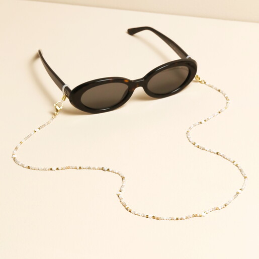 White semi-precious stone beaded star glasses chain attached to dark sunglasses