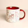 Cream ceramic mug with red sketched dog illustrations and red glazed handle and interior.