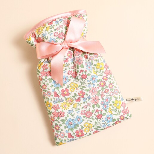 Small hot water bottle in colourful Annabella floral Liberty print with pink satin bow