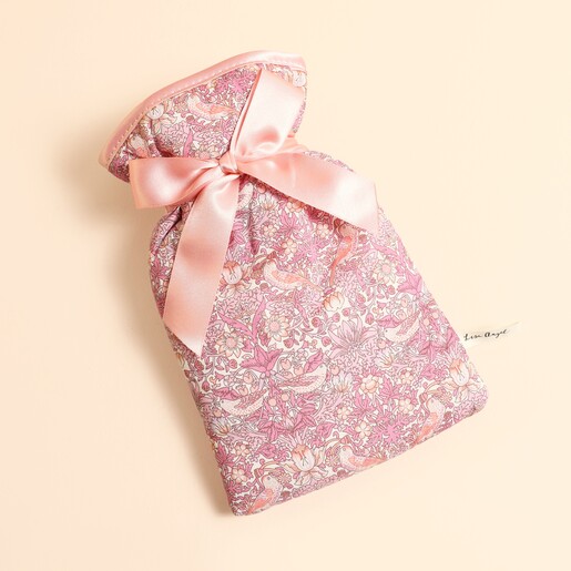 Small pink Liberty Strawberry Thief floral print hot water bottle with ribbon bow