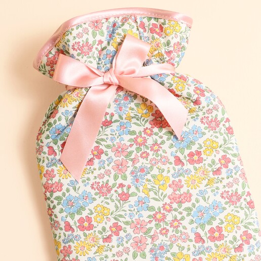 Close-up of the Annabella floral Liberty cotton cover and tied pink bow