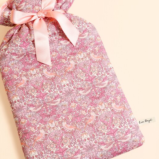 Close up of the intricate bird and floral Strawberry Thief cotton cover