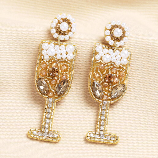 Gold Sparkly Beaded Drop Stud Earrings on Neutral Fabric