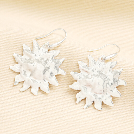 hammered earrings in silver with sun design