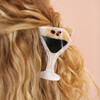 close up of cocktail-inspired hair clip on blonde hair