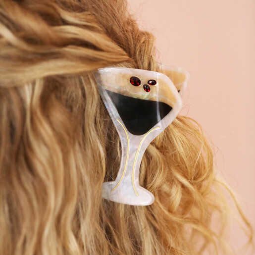 close up of cocktail-inspired hair clip on blonde hair
