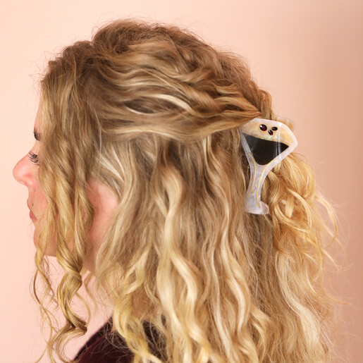 resin hair clip on curly blonde hair