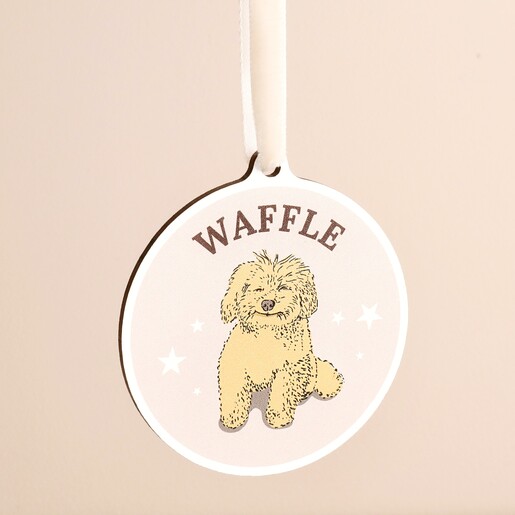 Close-up of personalised wooden dog ornament featuring a fluffy dog named Waffle.