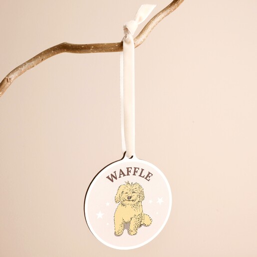 Personalised wooden dog Christmas ornament with cockapoo illustration hanging from white velvet ribbon.