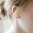 Crystal Daisy Huggie Hoop Earrings in Silver on Model