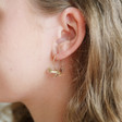 Lisa Angel Ladies' Gold Pterodactyl Dinosaur Charm Hoop Earrings on Model as Worn