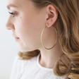 Large Hoop Earrings in Gold on Model