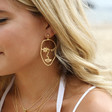 Lisa Angel Winking Face Drop Earrings in Gold on Model
