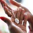 Model Holds Lisa Angel Women's Personalised 'Your Drawing' Oval Locket Necklace