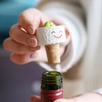 California Roll Sushi Cork Bottle Stopper Being removed from bottle by model