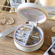Inside of Personalised Grey Rainbow Name Mini Round Travel Jewellery Case