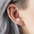 Tiny Gold Sterling Silver Crystal Star Stud Earrings on Model