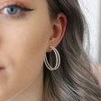 Dotted Double Hoop Earrings in Silver on Model
