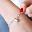 Lisa Angel Ladies' Toggle and Heart Charm Bracelet in Silver on Model