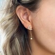 Model Wearing Lisa Angel Ladies' Crystal Moon and Star Charm Drop Earrings in Gold