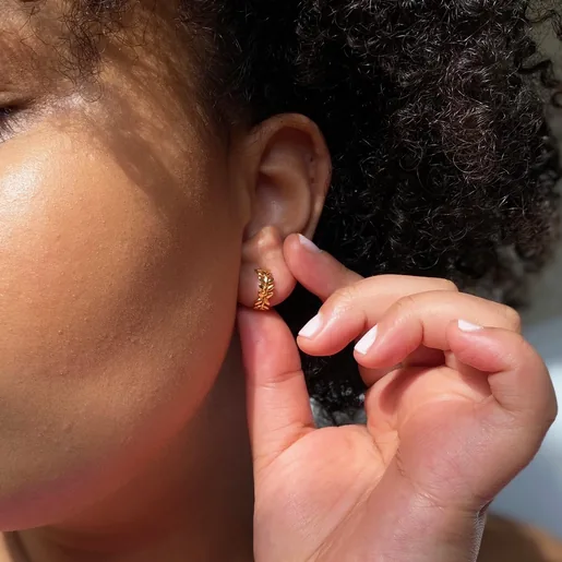 Model Wearing Lisa Angel Ladies' Fern Leaf Huggie Hoop Earrings in Gold
