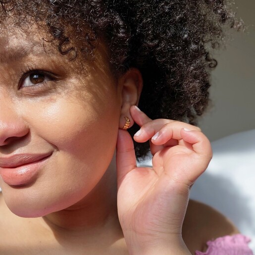 Model Wearing Lisa Angel Fern Leaf Huggie Hoop Earrings in Gold
