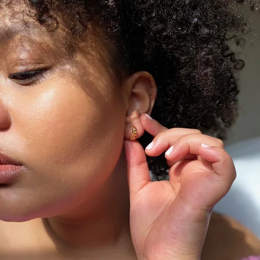 Lisa Angel Fern Leaf Huggie Hoop Earrings in Gold on Model