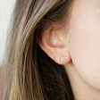 Delicate Rose Gold Mismatched Heart Stud Earrings on Model