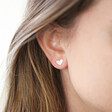 Model Wears Delicate Mismatched Heart Stud Earrings in Silver