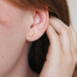 Model Wearing Lisa Angel Ladies' Mismatched Star and Moon Stud Earrings in Gold