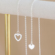 close up of hearts on Lisa Angel Mismatched Heart Lariat necklace in Silver