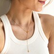 Model Wearing Mismatched Heart Lariat necklace in Gold from Lisa Angel