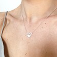 Model Wearing Lisa Angel Ladies' Mismatched Heart Outline Necklace in Silver