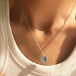 Lisa Angel Scalloped Edge Heart Necklace in Silver on Model