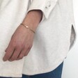 Gold Adjustable Hug Hands Bangle on Model