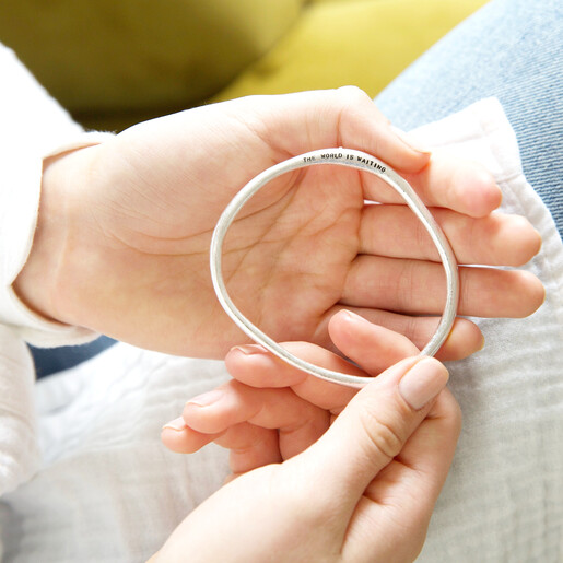 Model Holding Lisa Angel Silver Personalised Organic Shape Bangle