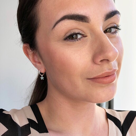 Model Wearing Lisa Angel Delicate Sterling Silver Star Charm Huggie Hoop Earrings
