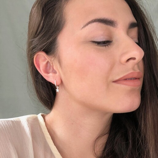 Model Wearing Lisa Angel Tiny Sterling Silver Star Charm Huggie Hoop Earrings