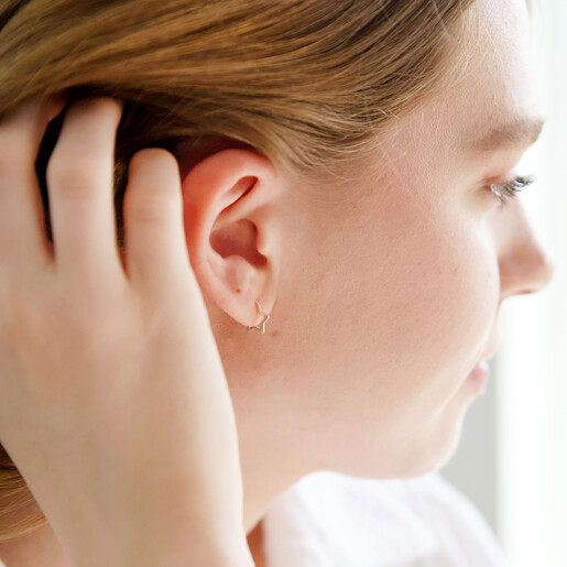 Model Wearing Ladies' Lisa Angel Mini Sterling Silver Star Huggie Hoop Earrings