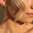 Gold Feather Stud Earrings From Lisa Angel on Model