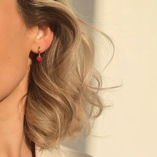 Model Wearing Lisa Angel Red Enamel Heart Charm Huggie Hoop Earrings