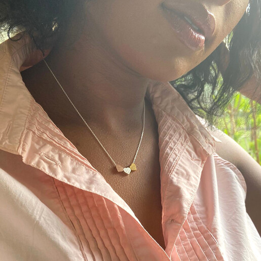 Brushed Mixed Metal Triple Heart Necklace on Model