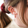 Red Enamel Heart Charm Huggie Hoop Earrings on Model