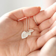 Lisa Angel Ladies' Personalised Sterling Silver Paw Print Heart Charm Necklace Held by Model